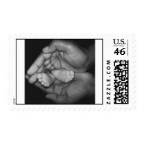 baby feet in father's hands postage postage