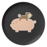 Baby Monkey Riding Backwards on a Pig Plates