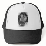 Baby peacock chick standing in a hand mesh hat