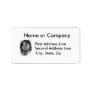 Baby peacock chick standing in a hand address label