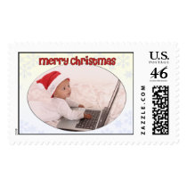 Baby using laptop merry christmas postage