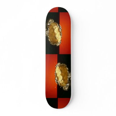 Baked potato with sour cream, against orange backg skate boards by inspirelove