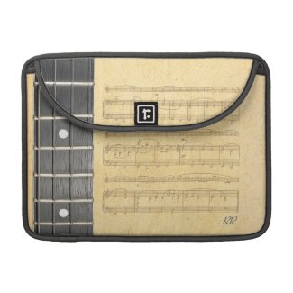 A Banjo Fretboard with 4 strings on old sheet Music on a Macbook Pro 13" Sleeve