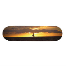 Barco de vela en la puesta del sol patinetas personalizadas