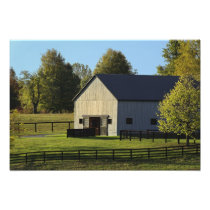 Barn on thoroughbred horse farm at sunrise,