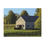 Barn on thoroughbred horse farm at sunrise, post card