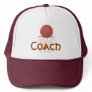 Basketball and net, with Coach on sports hat.