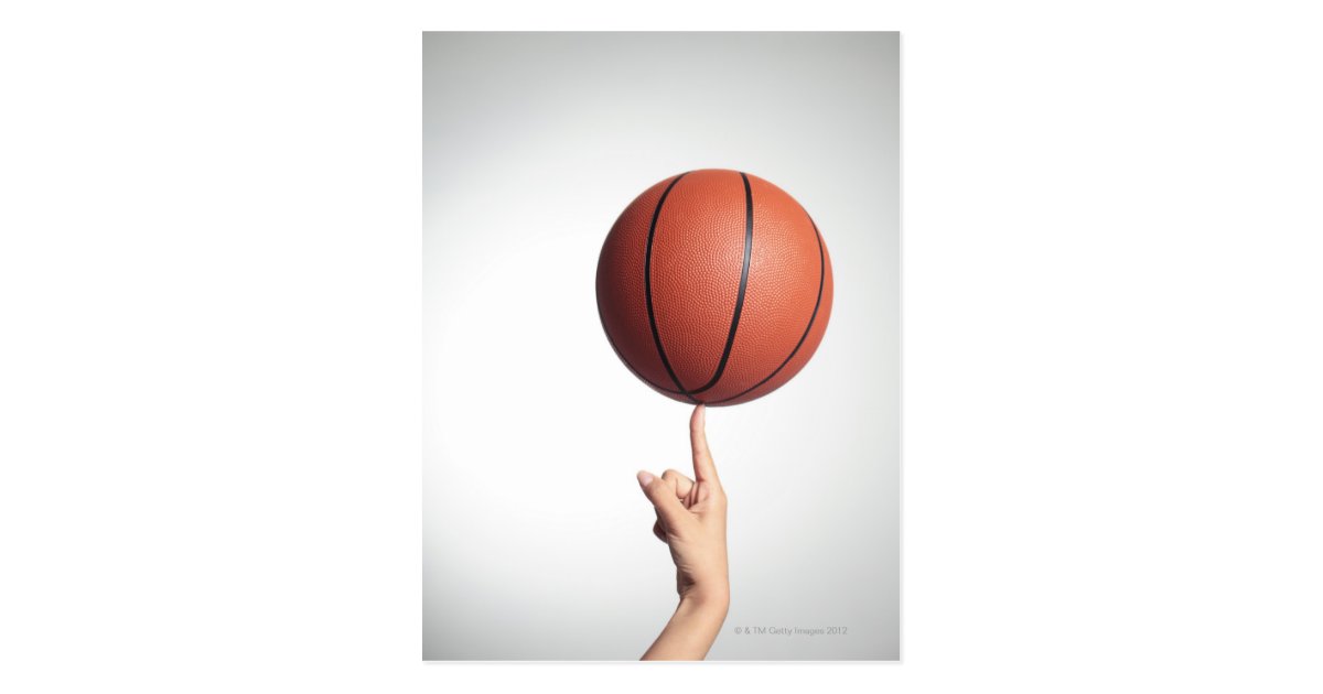 Basketball on index finger,hands closeup postcard Zazzle