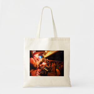 bass player playing jawbone crowd colorful paintin tote bag