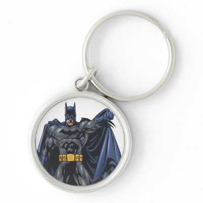 Batman holds up cape keychains