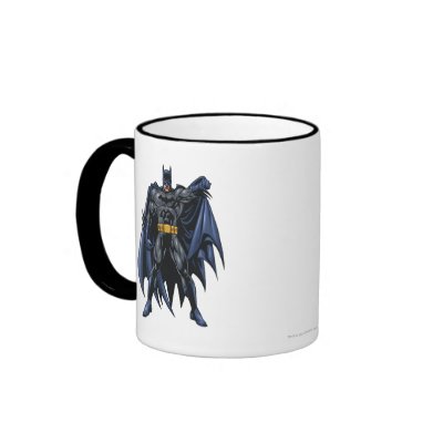 Batman holds up cape mugs