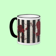 Be My Valentine Mug - Black and white stripes with pretty red hearts and the words 'Be My Valentine' Fill it with her/his favorite candies and top it off with a pretty bow. A perfect Valentins gift for your special someone!