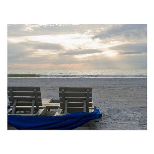 Beach chairs on St. Pete's beach at sunset. Postcard