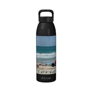 beach chairs surfboards umbrellas sand ocean reusable water bottles