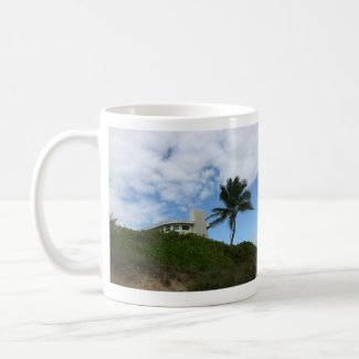 Beach House on Hill with sky and palm tree mug
