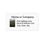 Beach litter plastic doll leg with sunrise personalized address label
