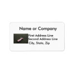 Beach pollution broken doll leg on sand personalized address label