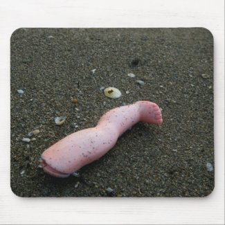 Beach pollution broken doll leg on sand mousepad