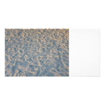 Beautful footprints all over beach sand, blue pink photo card template