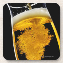 Beer been poured into glass, studio shot beverage coasters