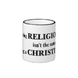 Being religious isn't the same as being Christian Coffee Mug