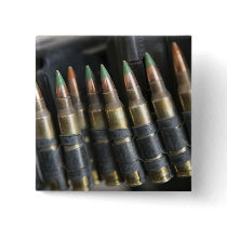 Belted bullets for an M-249 squad automatic wea Buttons