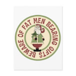 0 - This Christmas graphic features Santa Claus holding a Christmas tree, with the funny caption, Beware Of Fat Men Bearing Gifts.: Sizes  Available colors: 0