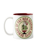 twotone_mug - This Christmas graphic features Santa Claus holding a Christmas tree, with the funny caption, Beware Of Fat Men Bearing Gifts.: Sizes  Available colors: maroon