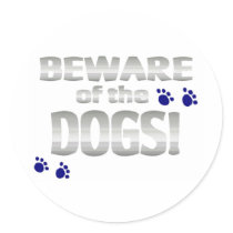Beware of the dogs! with blue paw prints sticker