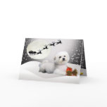 Bichon laying in snow with Santa Over Head Greeting Card
