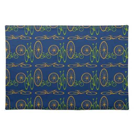 Bicycle in green and orange on blue placemat.