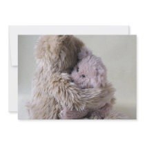 big teddy bear holds little bear invitation