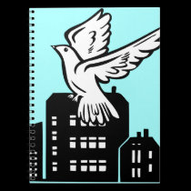 Bird flying by factory notebooks