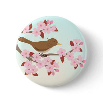 Bird sitting in a cherry blossom tree button