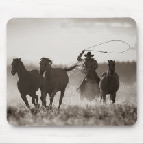 Black and White photo of a Cowboy Lassoing Horses Mouse Pad