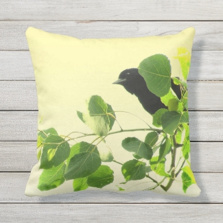 Black Bird Green Leaves on Yellow Outdoor Pillow