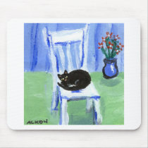 Black cat naps on chair mousepads