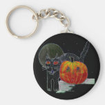 black cat pumpkin and moon keychains