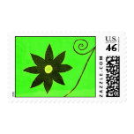 black flower on green stamps