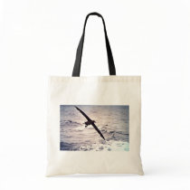 Black-footed albatross in flight tote bags