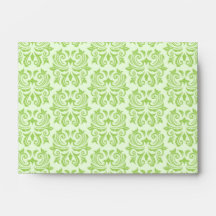 Black handlebar mustache on green damask pattern envelopes