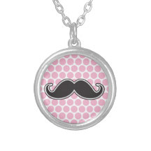 Black handlebar mustache on pink polka dot pattern pendants