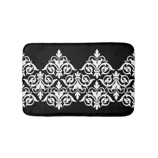 Shop by category Black And White Bath Rug Add a bold or subtle statement to your bathroom with a black and white bath rug. These rugs have smaller dimensions than area rugs and are ideal for catching water as you step out of the bath or shower.