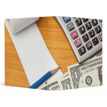 Blank list with dollar bills and calculator binders