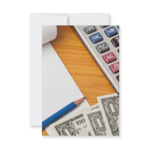 Blank list with dollar bills and calculator announcements