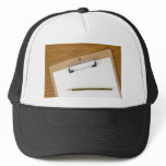 Blank paper on a clipboard trucker hat