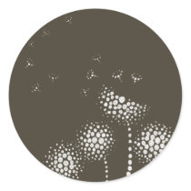 blowing flowers round sticker