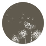 blowing flowers round sticker