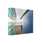 Blue-and-green beach huts stretched canvas prints