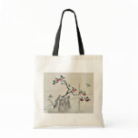 Blue bird on a branch of a fruit tree tote bags